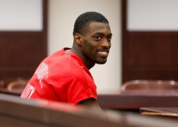 Detroit Lions cornerback Terrion Arnold smiles in court during his pretrial detention hearing.
