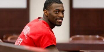 Detroit Lions cornerback Terrion Arnold smiles in court during his pretrial detention hearing.
