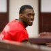 Detroit Lions cornerback Terrion Arnold smiles in court during his pretrial detention hearing.