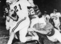 Jim Lindsey (21) Arkansas back gallops for eight yards before Texas' Barney Giles (68) made a dive to trip him up in the first quarter