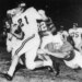 Jim Lindsey (21) Arkansas back gallops for eight yards before Texas' Barney Giles (68) made a dive to trip him up in the first quarter