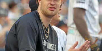 New York Yankees pitcher Cam Schlittler (31) in the dugout during the first inning.
