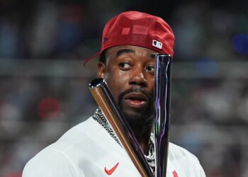Jordan Walker holds the trophy after winning the MLB All-Star Home Run Derby.