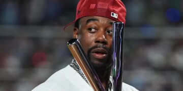 Jordan Walker holds the trophy after winning the MLB All-Star Home Run Derby.