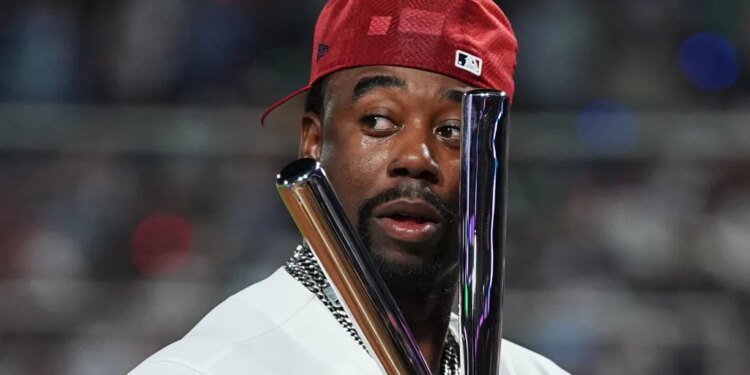 Jordan Walker holds the trophy after winning the MLB All-Star Home Run Derby.