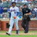 Jorge Polanco walks back to the dugout after striking out looking with the bases loaded in the seventh inning of the Mets' 3-2 win over Braves on July 29, 2026 in the first game of a split doubleheader at Citi Field.