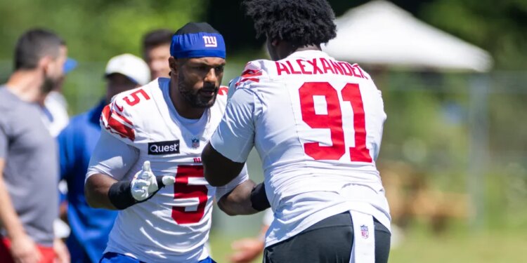 Kayvon Thibodeaux (5) and Darius Alexander (91) of the New York Giants work out at training camp.