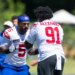 Kayvon Thibodeaux (5) and Darius Alexander (91) of the New York Giants work out at training camp.
