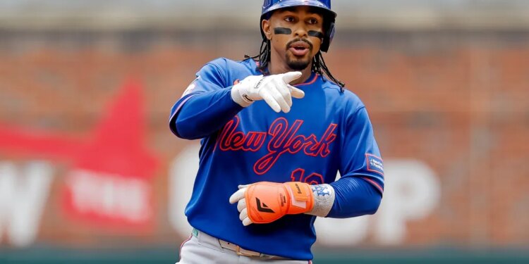 Francisco Lindor of the New York Mets reacts after hitting an RBI single.