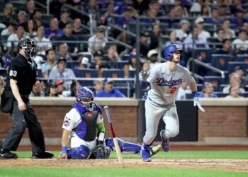 Los Angeles Dodgers right fielder Kyle Tucker #23 tosses his bat after he hits a two-run home run during the eighth inning on July 24, 2026.