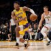 Basketball player Rui Hachimura in a Lakers uniform dribbles the ball downcourt while being guarded by Michael Porter Jr. in a Denver Nuggets uniform.
