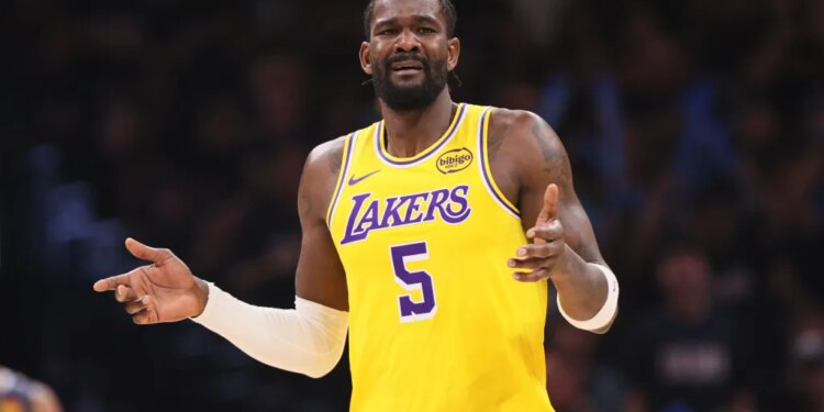 Deandre Ayton in a yellow Lakers jersey with the number 5, looking distressed.