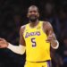Deandre Ayton in a yellow Lakers jersey with the number 5, looking distressed.
