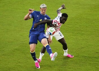 Folarin Balogun and Tarik Muharemovic challenge for the soccer ball.