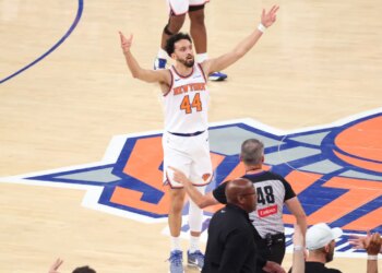 New York Knicks guard Landry Shamet reacting after hitting a 3-point shot in Overtime.