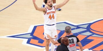 New York Knicks guard Landry Shamet reacting after hitting a 3-point shot in Overtime.