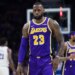 LeBron James wearing a purple Lakers jersey with number 23.