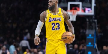 LeBron James of the Los Angeles Lakers dribbling the ball during a game against the Brooklyn Nets.