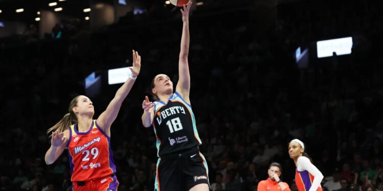 New York Libertyâs Pauline Astier (18) drives to the basket past Phoenix Mercury guard Jovana Nogic (29) during the second half of a WNBA basketball game at the Barclays Center in Brooklyn on Friday, May 29, 2026.