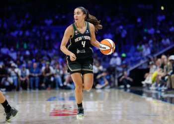 New York Liberty guard Marine Fauthoux dribbles the ball up court.
