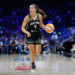 New York Liberty guard Marine Fauthoux dribbles the ball up court.