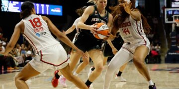 New York Liberty guard Marine Johannes (23) drives to the basket as Washington Mystics forward Kiki Iriafen (44) defends.