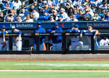 The New York Mets bench reacts during the ninth inning against the Athletics.