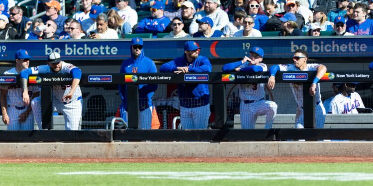 The New York Mets bench reacts during the ninth inning against the Athletics.
