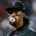 New York Mets' Francisco Lindor blowing a bubble with gum during a baseball game.