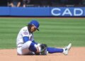 New York Mets shortstop Francisco Lindor (12) sitting on the ground after an error during the ninth inning.