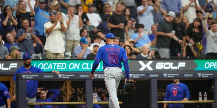 Jul 20, 2026; Milwaukee, Wisconsin, USA; New York Mets pitcher Freddy Peralta (51) walks to the dugout after being pulled from the game during the sixth inning against the Milwaukee Brewers at American Family Field. Mandatory Credit: Jeff Hanisch-Imagn Images