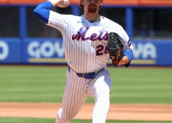 New York Mets pitcher Nolan McLean #26 throws a pitch.