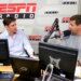 Mike Greenberg and Mike Golic of ESPN Radio’s "Mike and Mike Show" sit at a desk with microphones and computers.