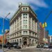 The 190 Bowery building, a large corner building with a green roof, in New York, New York.