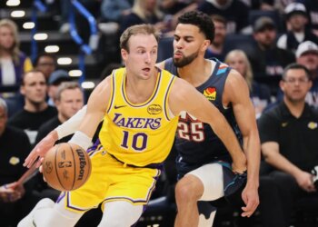 Basketball players Ajay Mitchell (Lakers #10) and Luke Kennard (#25) during a game.