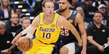 Basketball players Ajay Mitchell (Lakers #10) and Luke Kennard (#25) during a game.