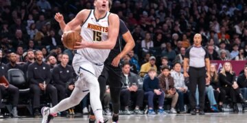 Denver Nuggets center Nikola Jokic (15) drives to the net in the second half against the Brooklyn Nets at Barclays Center on Friday, Dec. 22, 2023, in Brooklyn, NY.