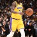 Basketball player Patrick Beverley dribbling the ball on the court.