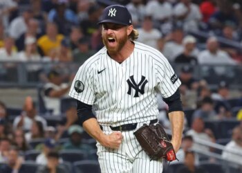 New York Yankees pitcher Paul Blackburn reacting after getting out of the seventh inning with men on base.