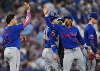New York Mets' Francisco Alvarez (4) and Francisco Lindor (12) celebrate after defeating the Toronto Blue Jays during a baseball game in Toronto on Tuesday, June 30, 2026. (