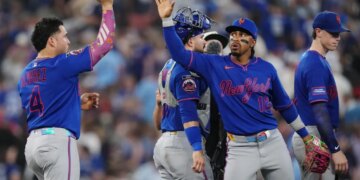 New York Mets' Francisco Alvarez (4) and Francisco Lindor (12) celebrate after defeating the Toronto Blue Jays during a baseball game in Toronto on Tuesday, June 30, 2026. (