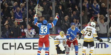 New York Rangers center Mika Zibanejad #93 reacts after New York Rangers defenseman Matthew Robertson #29 scores the game winning goal during the overtime. The New York Rangers defeat Boston Bruins 4-3.