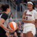 Atlanta Dream forward Angel Reese (5) talks with game official Tiara Cruse after a play against the Toronto Tempo during the second half at Coca-Cola Coliseum.