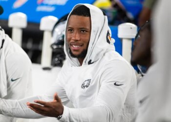 Philadelphia Eagles running back Saquon Barkley (26) looks on from the sidelines.
