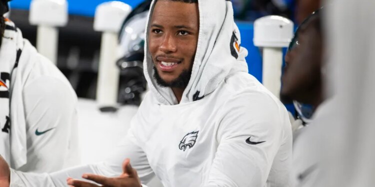 Philadelphia Eagles running back Saquon Barkley (26) looks on from the sidelines.