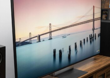The Sony Bravia 9 II RGB LED TV on a wooden credenza with SVS speakers on either side.