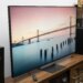 The Sony Bravia 9 II RGB LED TV on a wooden credenza with SVS speakers on either side.