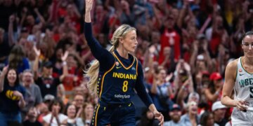Indiana Fever player Erica Wheeler (8) raises her hand during a game against the New York Liberty.