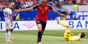 Spain's Mikel Merino (6) celebrates scoring their second goal in front of Belgium's Timothy Castagne (21) and goalkeeper Senne Lammens (12) during the World Cup quarterfinal soccer match between Spain and Belgium in Inglewood, Calif., near Los Angeles, Friday, July 10, 2026.