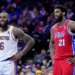 LeBron James of the Los Angeles Lakers and Joel Embiid of the Philadelphia 76ers stand on the court during an NBA basketball game.